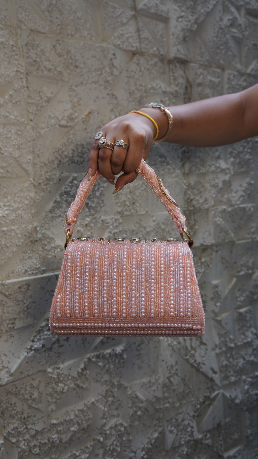Pink bridal clutch angled view showing layered beadwork