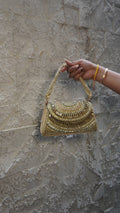 Golden heavy embroidered bridal clutch front with U-shaped beadwork