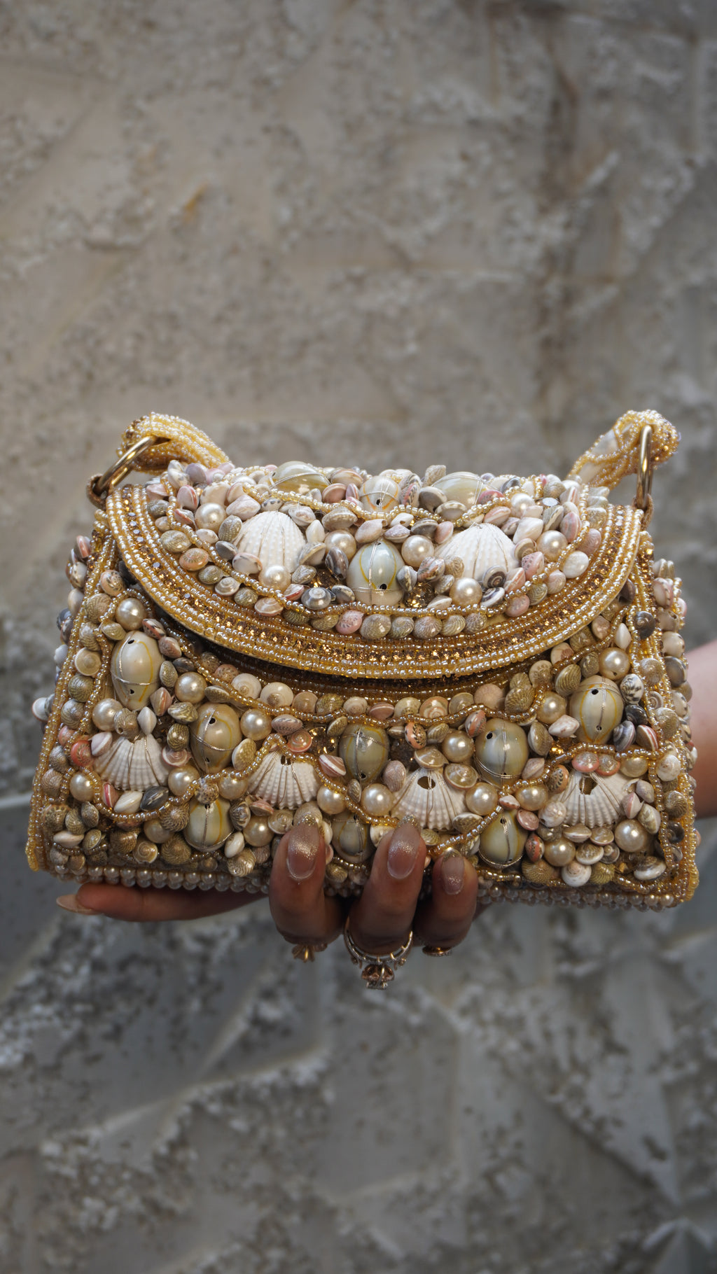 Golden shell work clutch with embellished handle