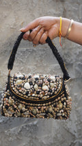 Black shell work clutch front with curved embellished flap