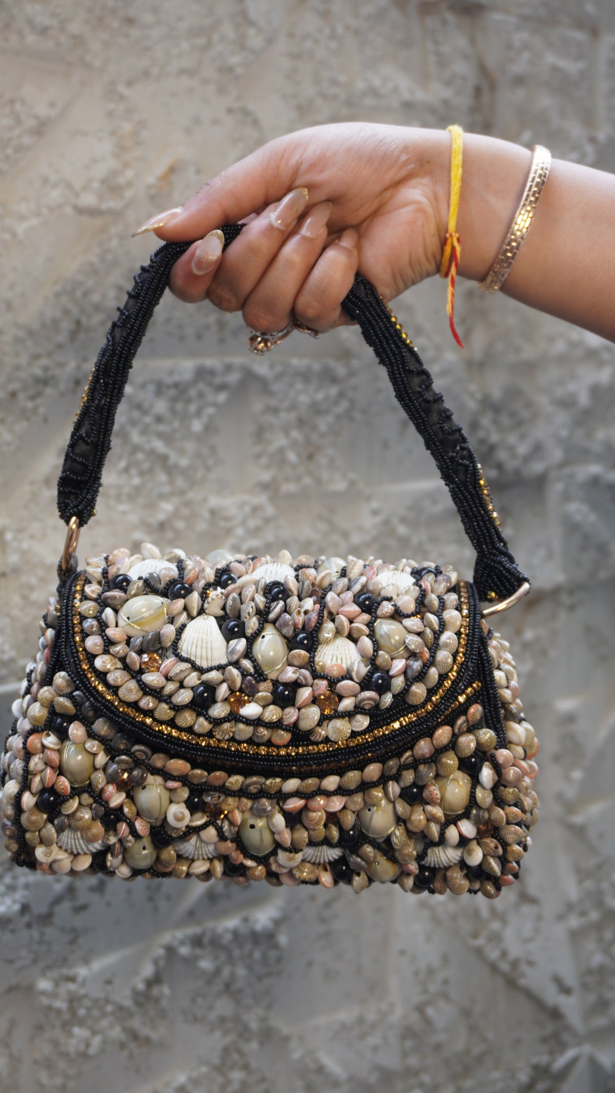 Black shell work clutch front with curved embellished flap