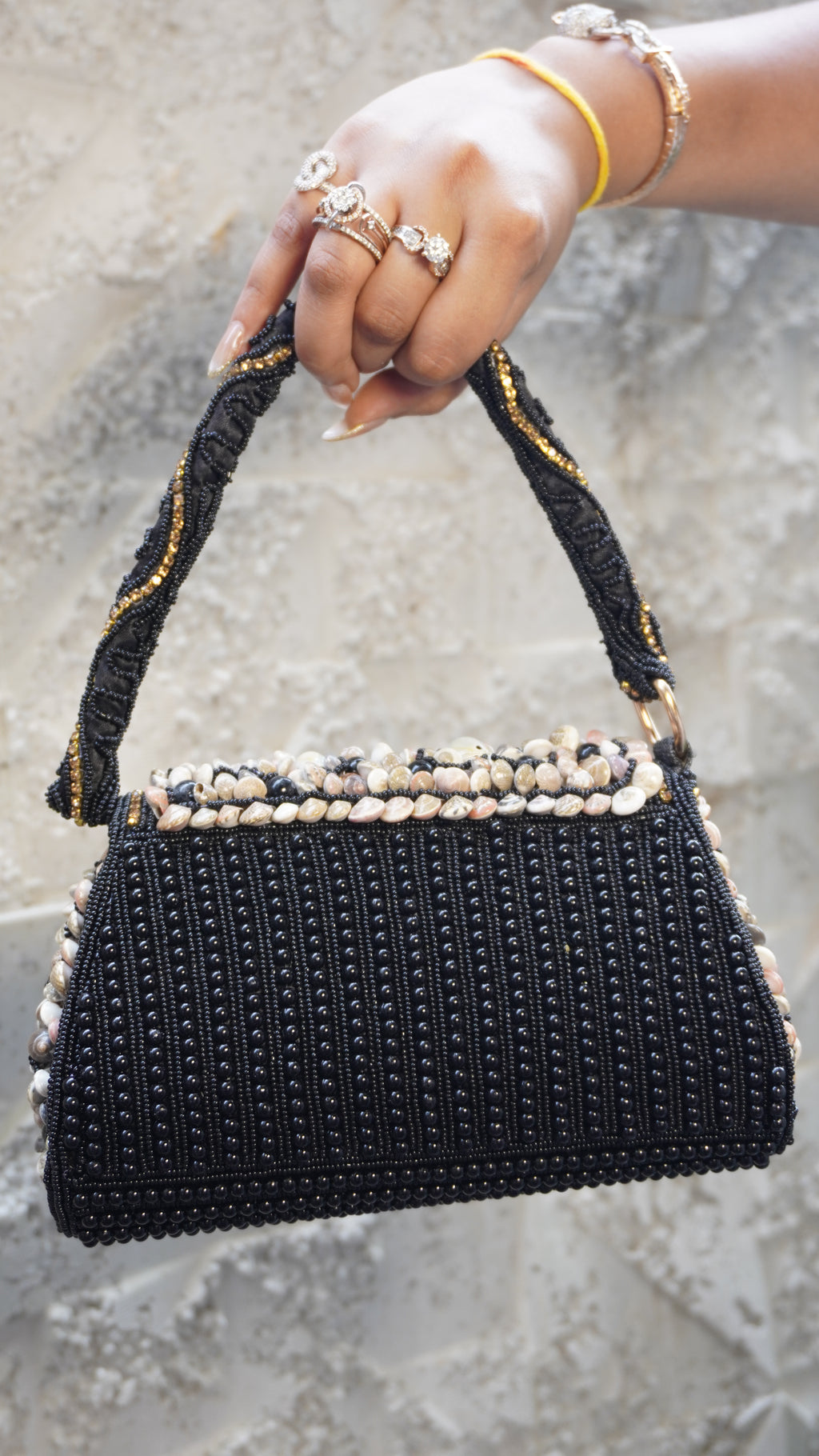 Black shell work clutch with matching embellished handle