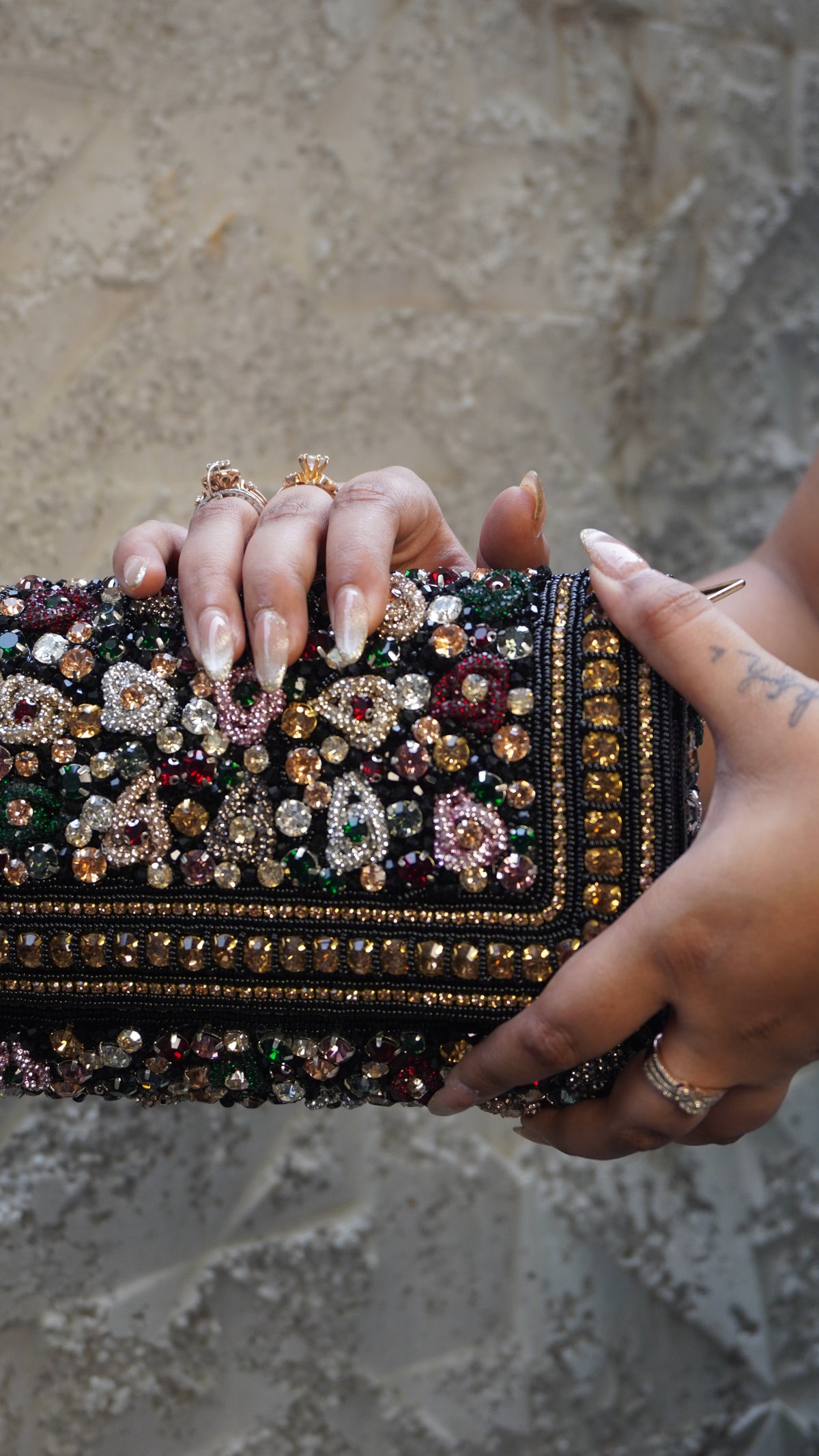 Black rectangular bridal clutch with heavy multicoloured embellishments
