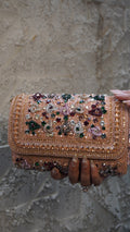 Pink rectangular bridal clutch front with decorative beadwork borders