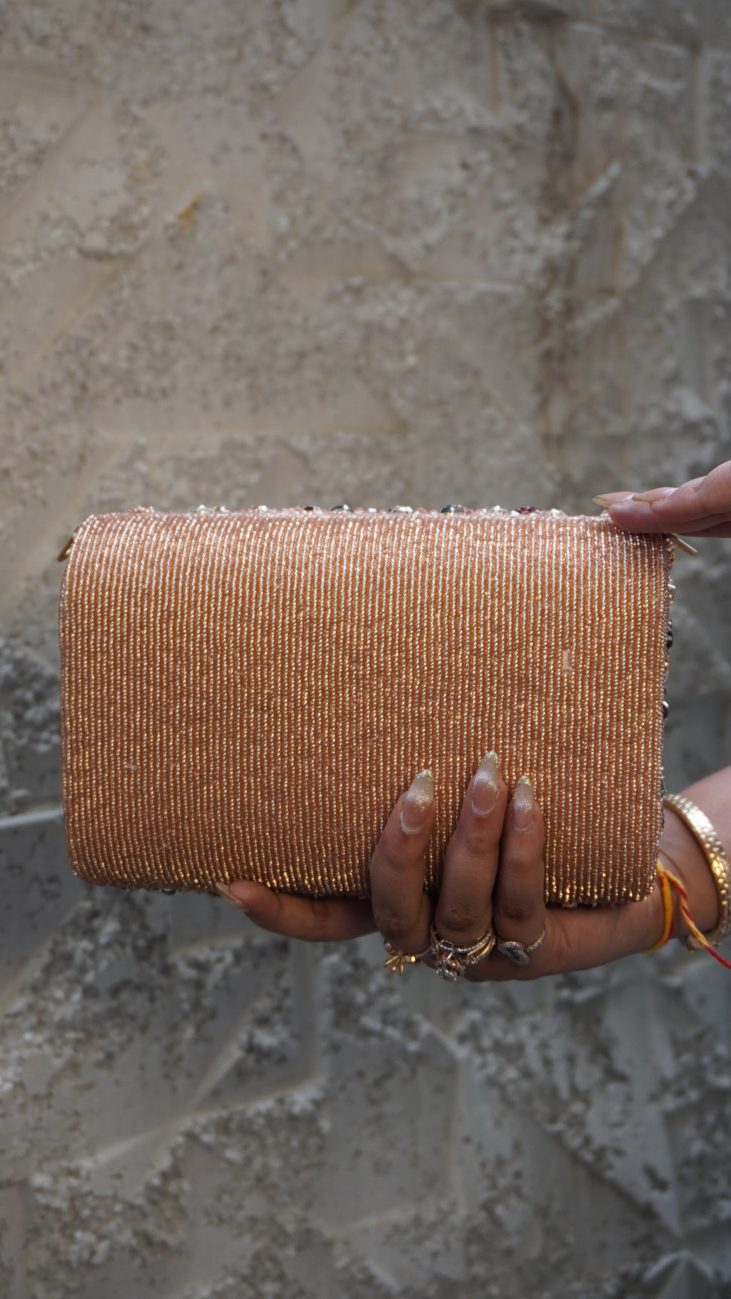 Pink rectangular bridal clutch with heavy multicoloured embellishments