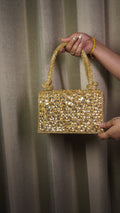 Dark golden heavy Indian crystal clutch front with embellished handles