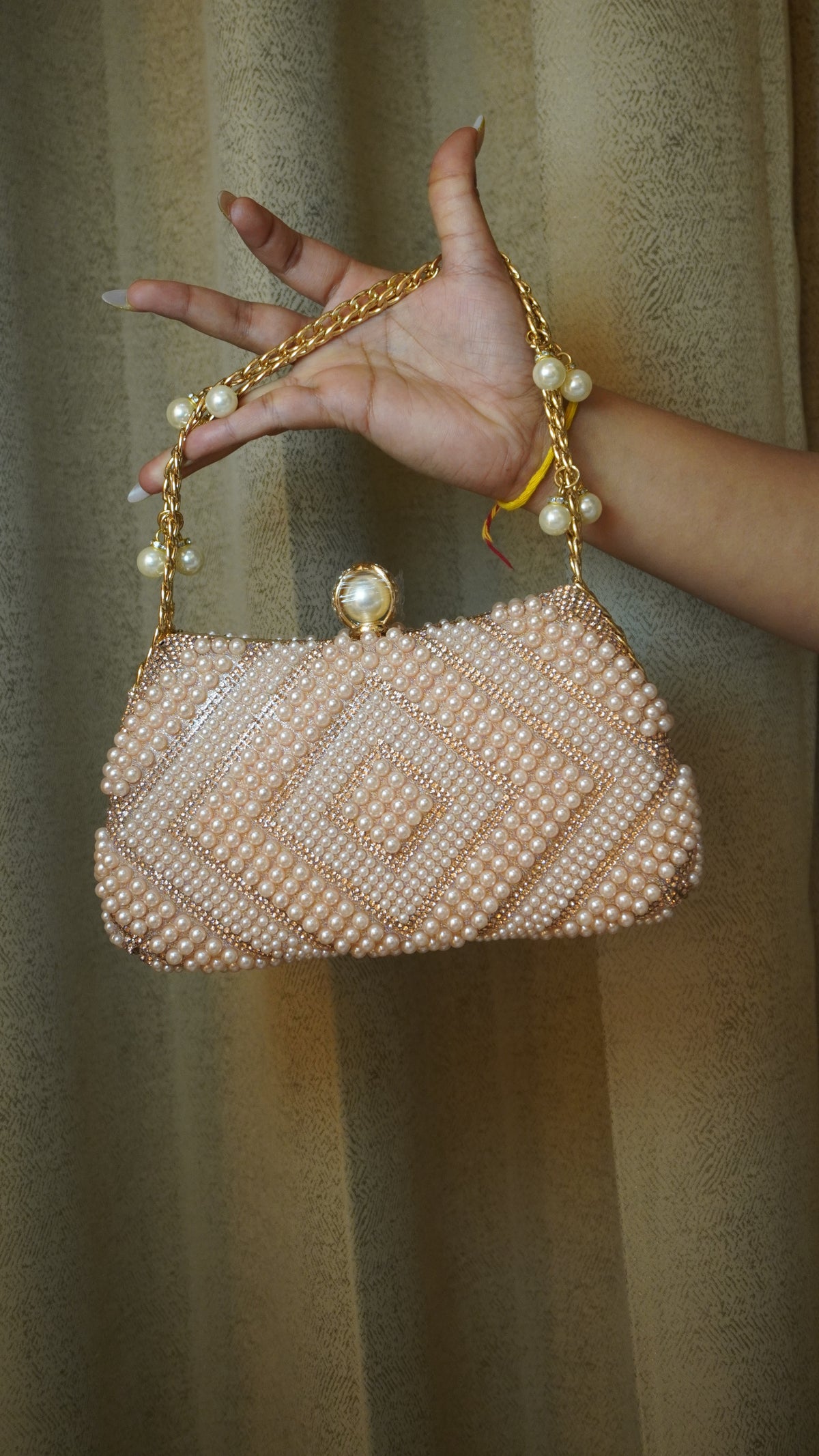Pink pearl beaded clutch front with diamond-pattern detailing