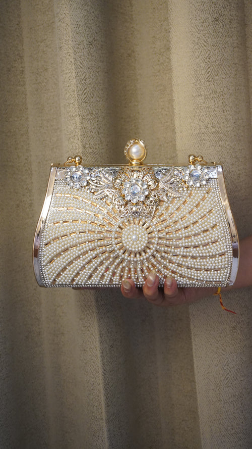 Brass clutch with radiating pearl beadwork and geometric decorative accents