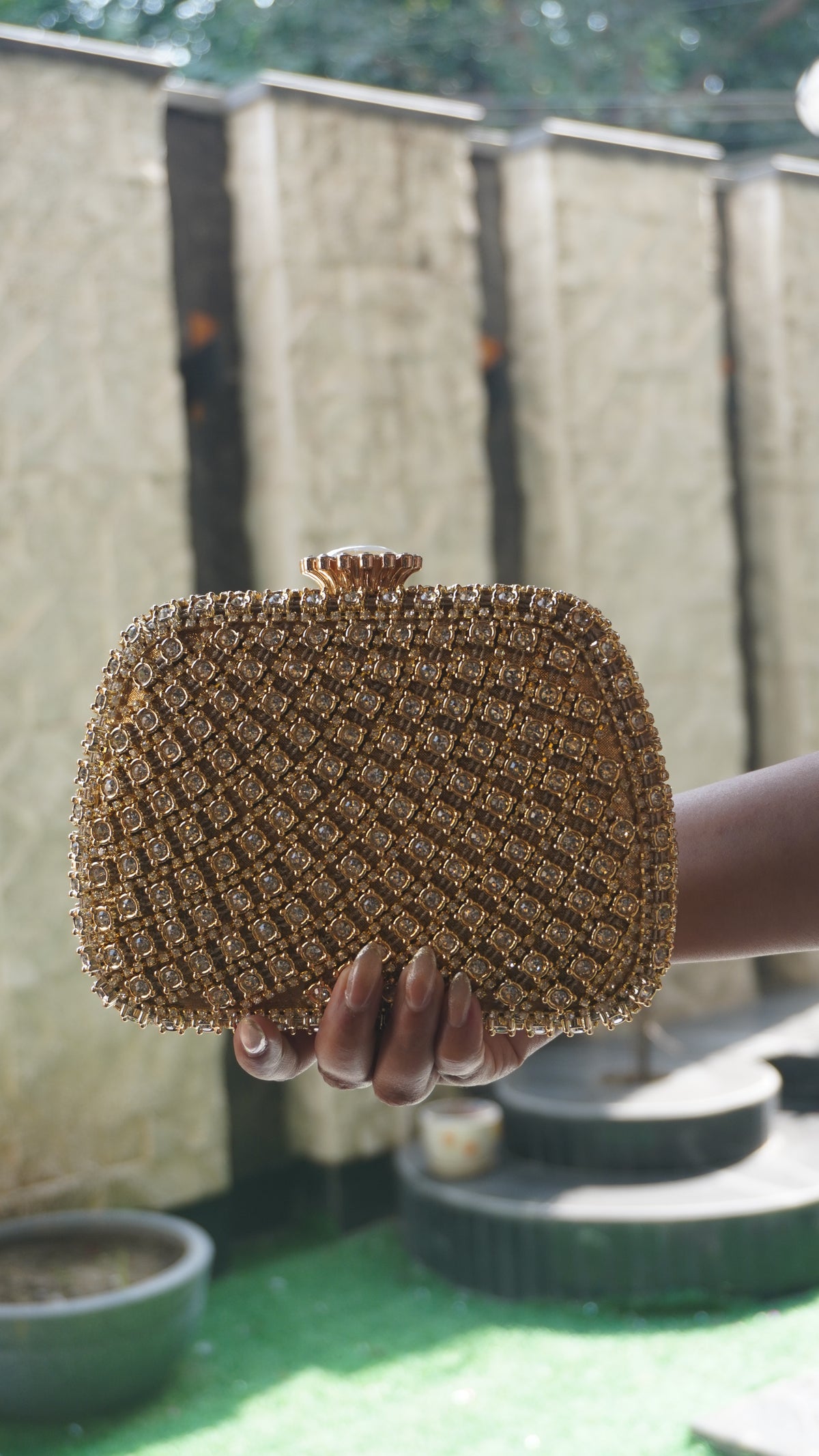 Golden Indian crystal bridal clutch viewed from above showing decorative clasp