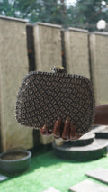 Silver crystal bridal clutch viewed from above showing decorative clasp