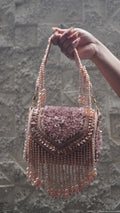 Pink handbag with floral beadwork, sparkling trim and cascading bead fringe