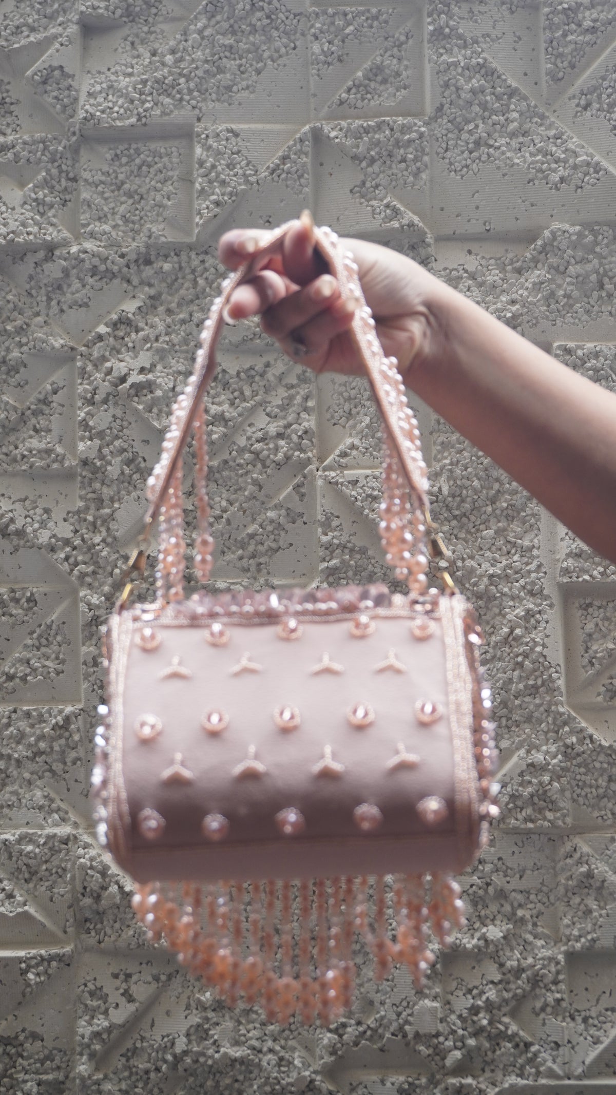 Pink floral beaded handbag showing embellished body and bead fringe