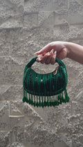 Emerald green beaded crescent small bag with teardrop fringe and short handle