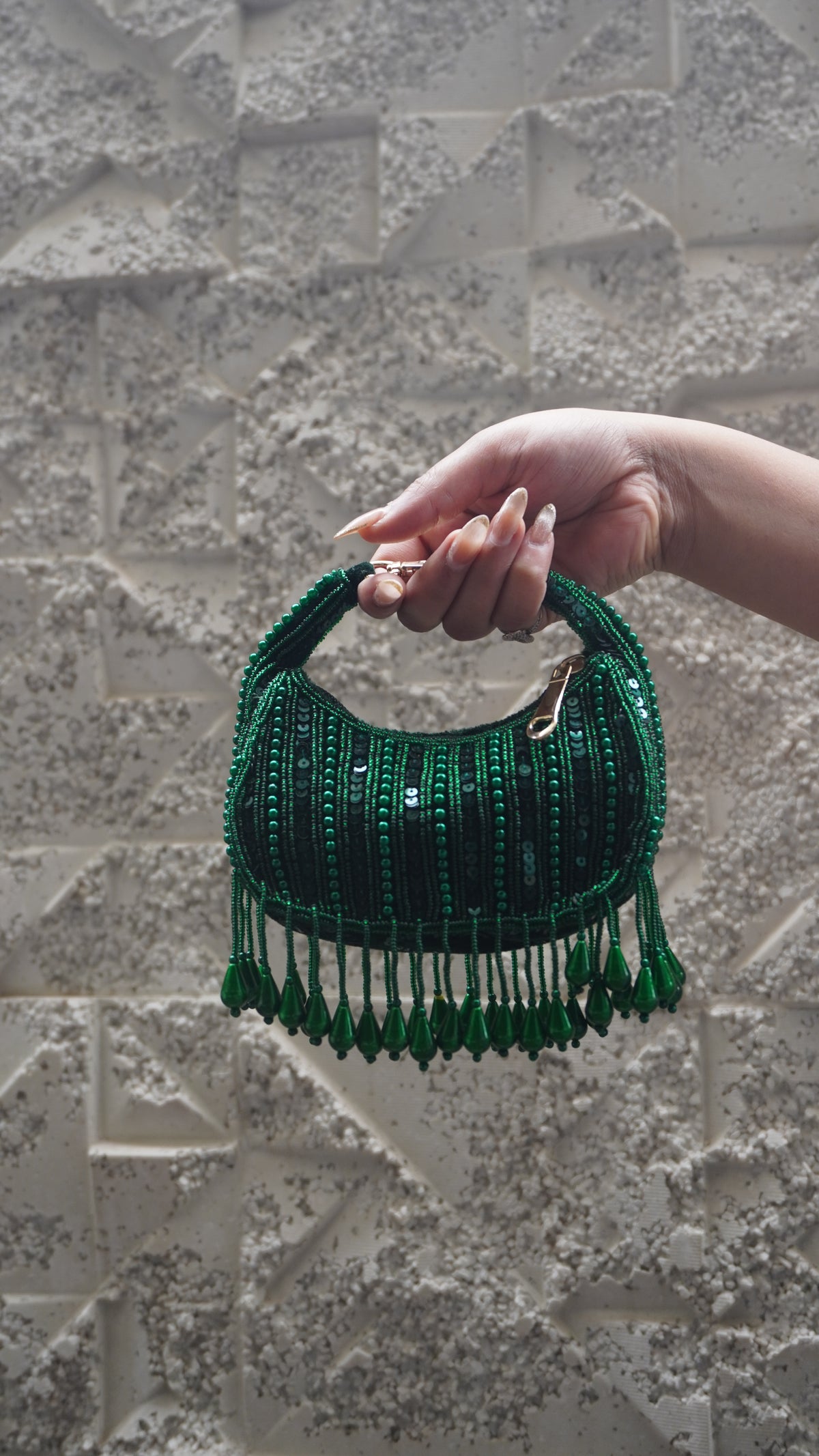 Emerald green beaded crescent small bag with teardrop fringe and short handle